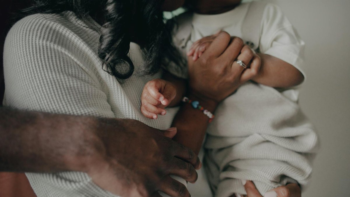 A close-up of a loving family embrace, highlighting the warmth and connection between parent and child.