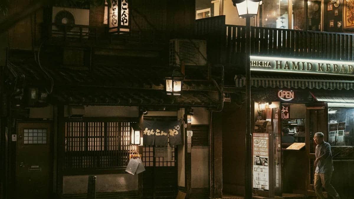 A quiet evening in Kyoto's Gion District featuring traditional architecture and lit shops.