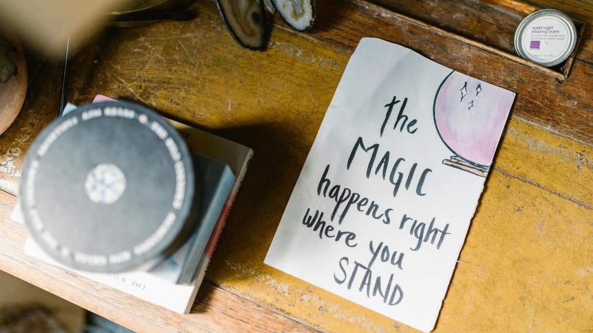 Inspirational quote with crystals and books, capturing a mystical vibe.