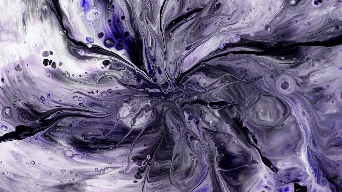 Intricate abstract design with swirling purple and black patterns, resembling fluid art or marbling.