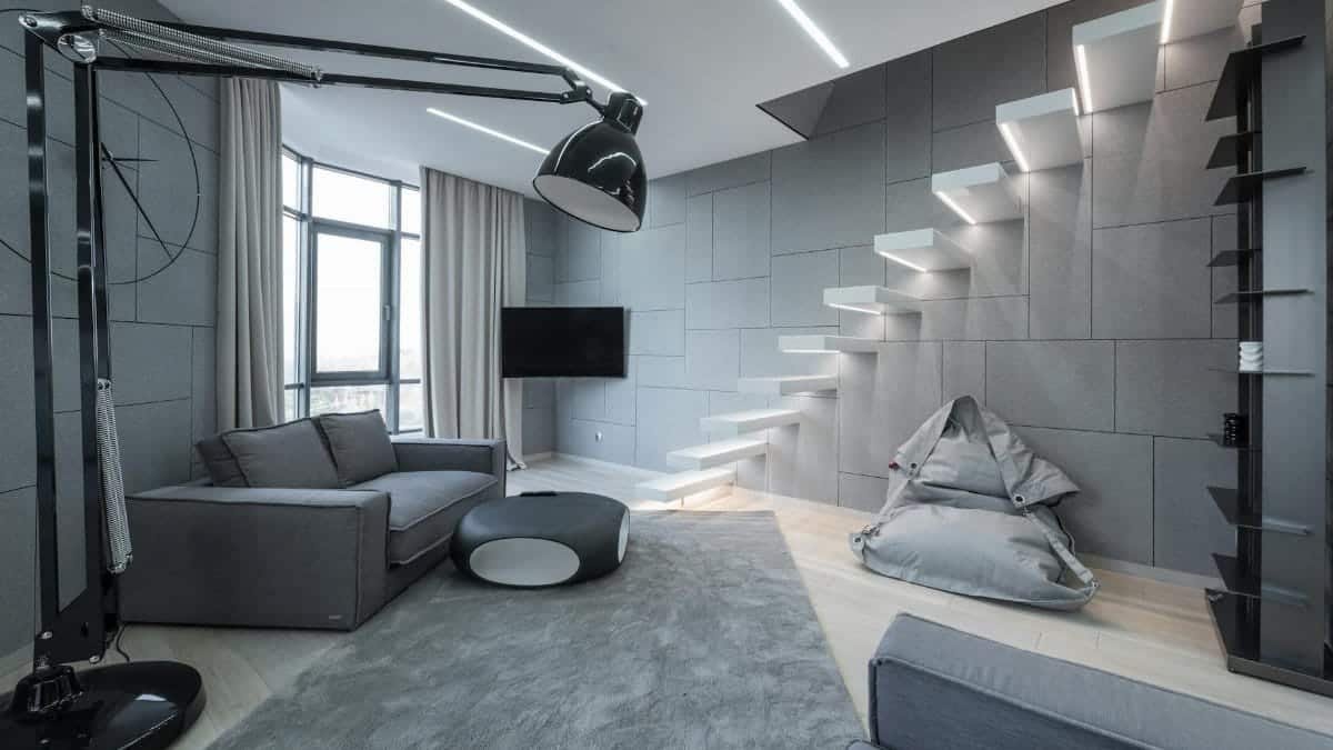 Living room interior with couch near table on carpet near lamp and bean bag chair near TV and steps near window