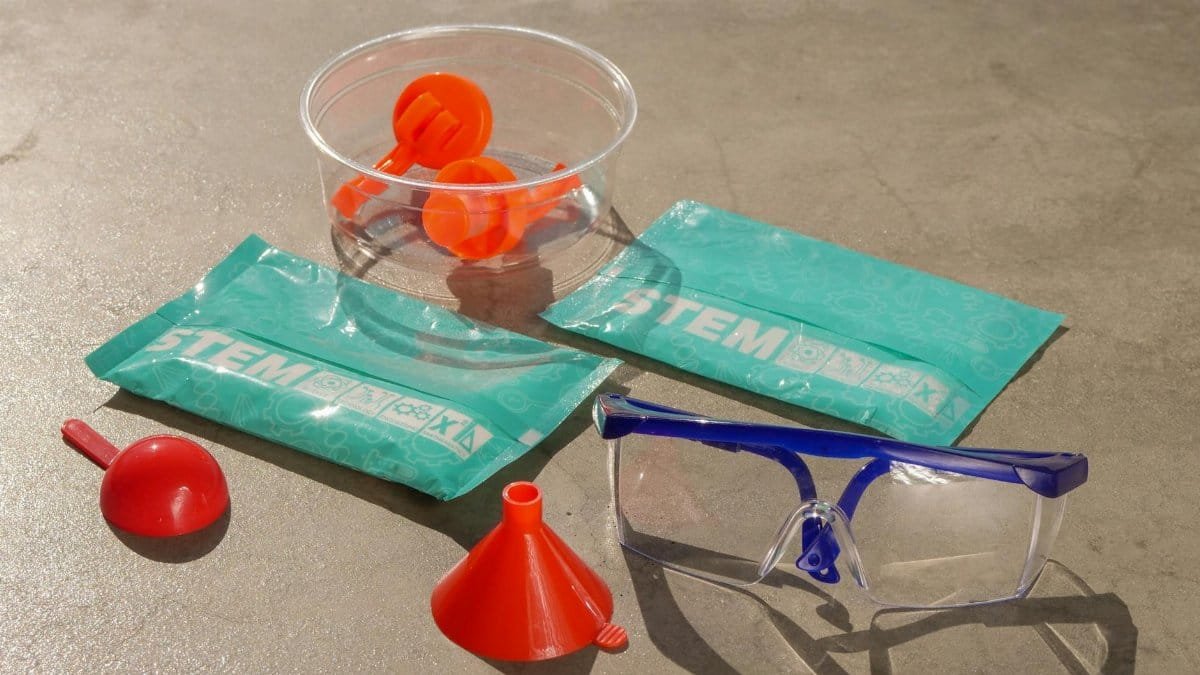 STEM education kits with safety goggles and lab equipment for hands-on learning and exploration.