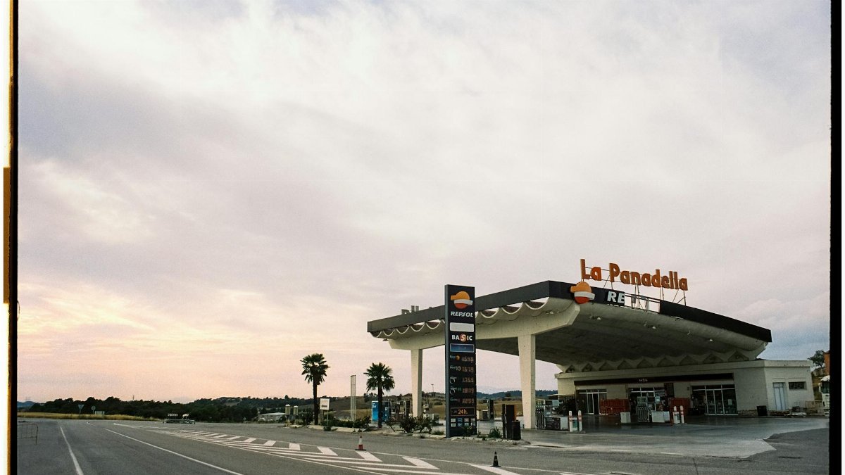 View of Repsol gas station at La Panadella, Spain under an expansive sky.