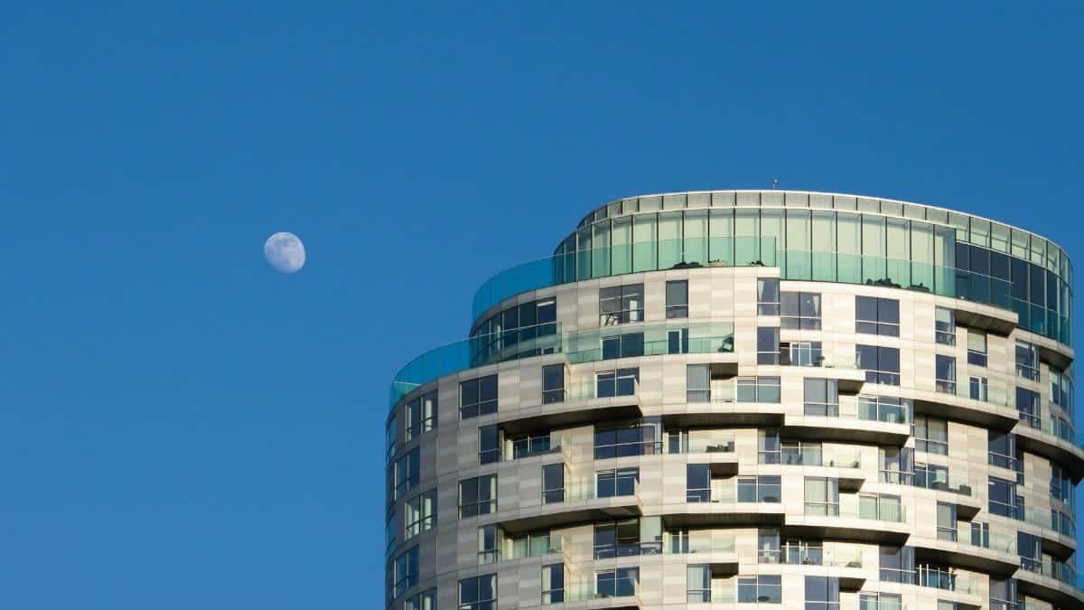 Contemporary high-rise building with the moon overhead in Lonoke, Arkansas.