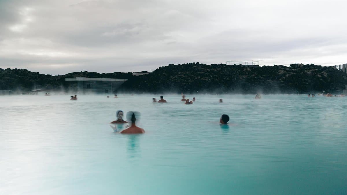 People enjoying relaxation and recreation in Iceland's soothing Blue Lagoon geothermal spa.