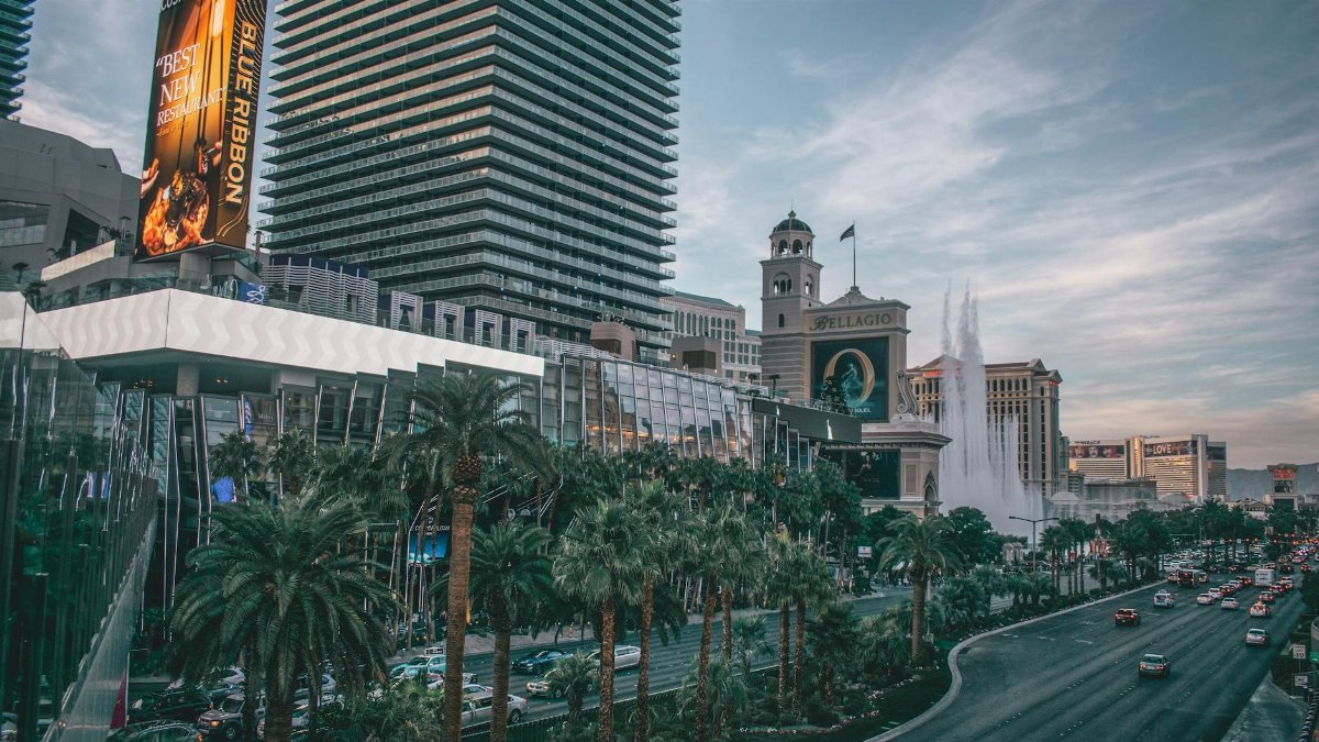 Vibrant view of Las Vegas's iconic skyline and busy boulevard with modern buildings and neon lights.