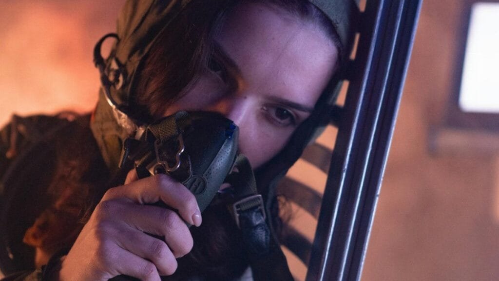 An astronaut in a space suit resting indoors, showcasing fatigue and futuristic themes.