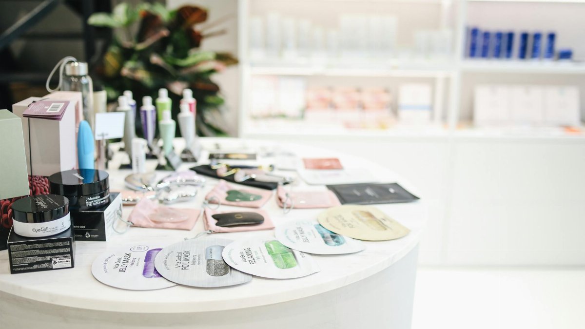 Wide selection of skincare and beauty products displayed in a modern retail setting.