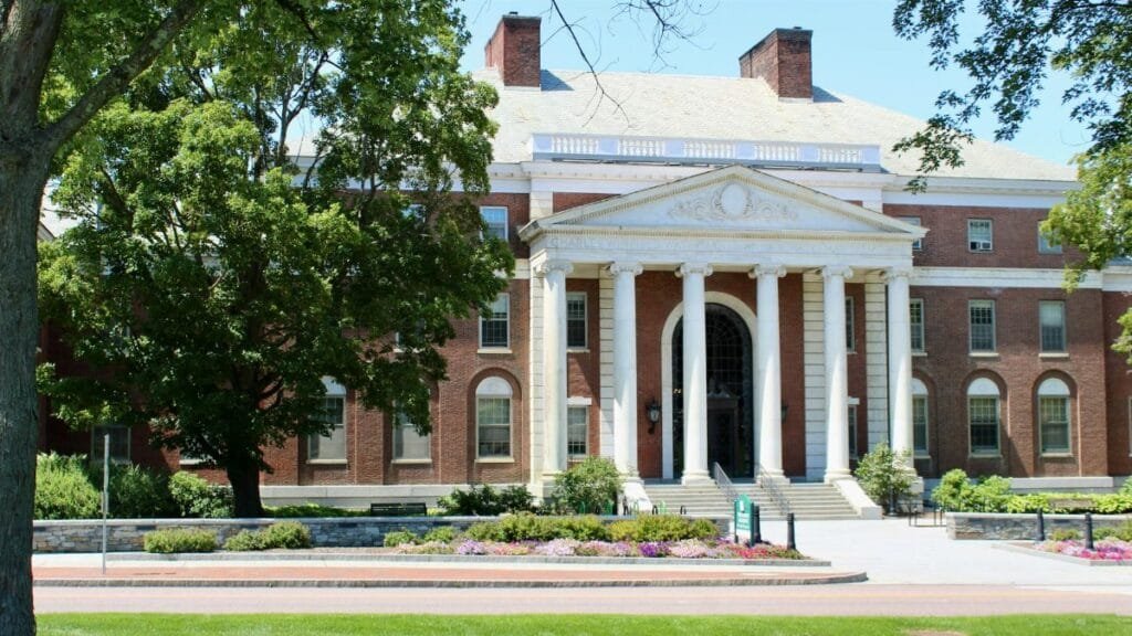 Elegant brick university building with columns in Burlington, VT.