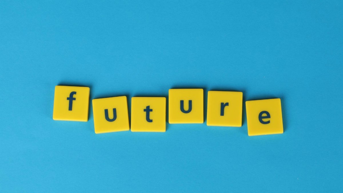 Yellow letter tiles spelling 'future' on a blue background, emphasizing creativity and optimism.