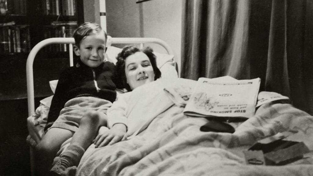 Charming vintage scene capturing a mother and son smiling together in a hospital.