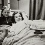 Charming vintage scene capturing a mother and son smiling together in a hospital.