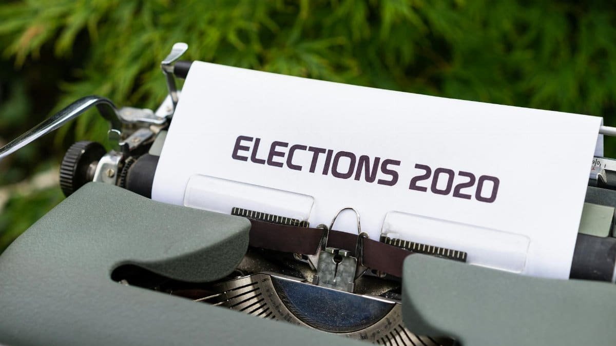 Close-up of a typewriter typing 'Elections 2020' outdoors.