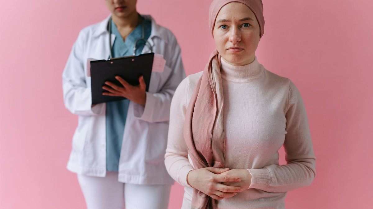 A hopeful cancer patient with a doctor in support during treatment process.