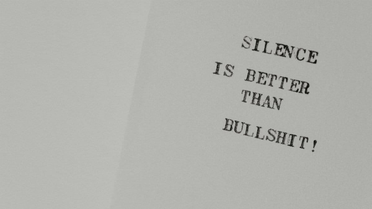 Minimalist design featuring the quote 'Silence is better than bullshit' on white paper.