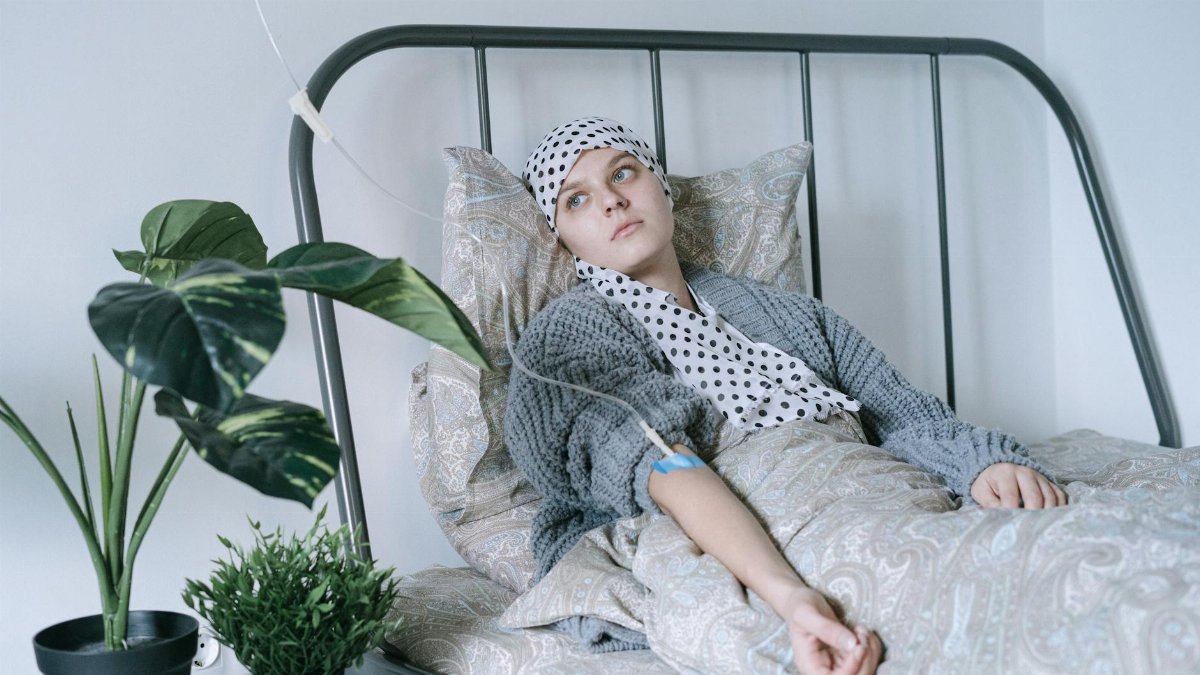 A young woman in recovery, embracing strength and hope during cancer therapy.
