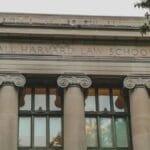 Classical architecture of Harvard Law School's facade with iconic columns, perfect for educational themes.