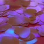 Scattered heart-shaped confetti creating a romantic and vibrant atmosphere, perfect for celebrations.