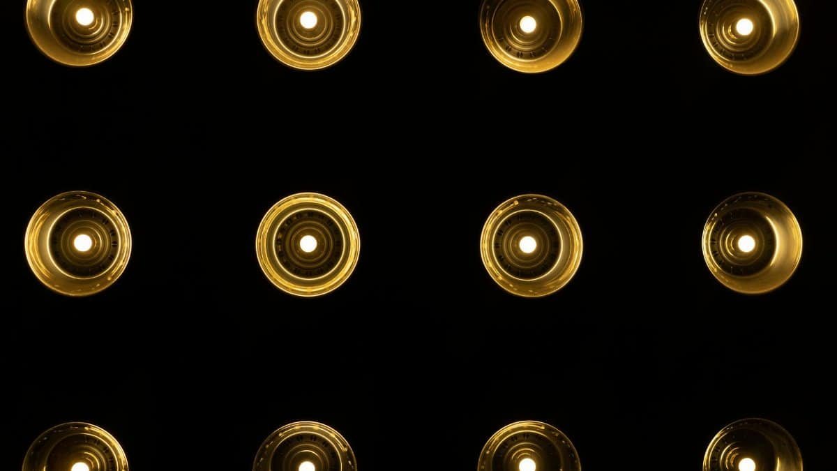 A symmetrical pattern of warm glowing lights set against a dark background, showcasing a creative light design.