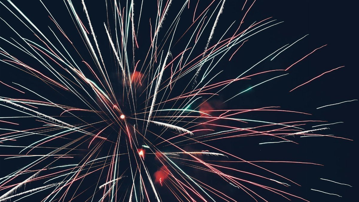 Colorful fireworks burst against a dark night sky, capturing the essence of celebration and joy.
