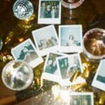 A nostalgic collection of instant photos amidst a festive party scene with wine glasses and disco decor.