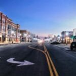 A serene twilight view of Main Street in Emporia, Kansas showcasing urban architecture.