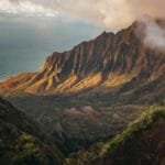 A stunning view of the Kalalau Valley with mountains and ocean in Kauai, Hawaii.