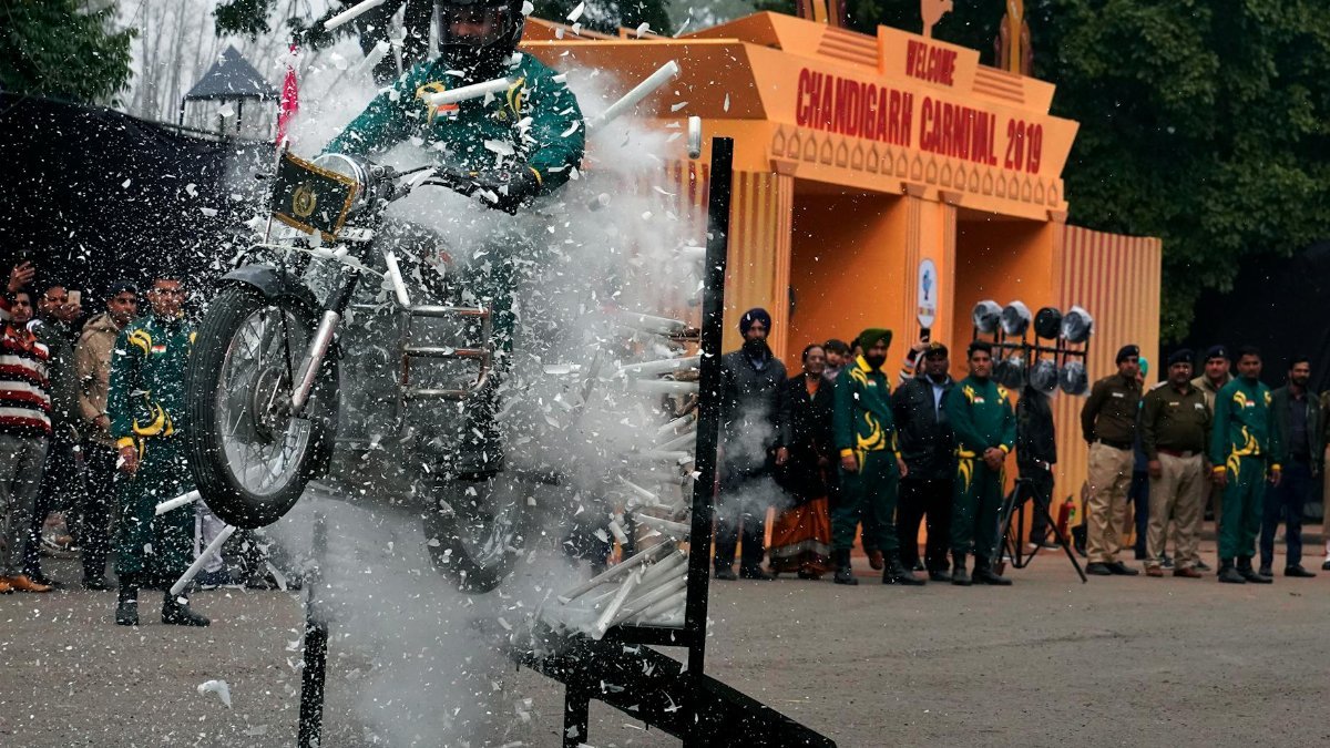 Daring motorcycle stunt breaking through glass at Chandigarh Carnival 2019.