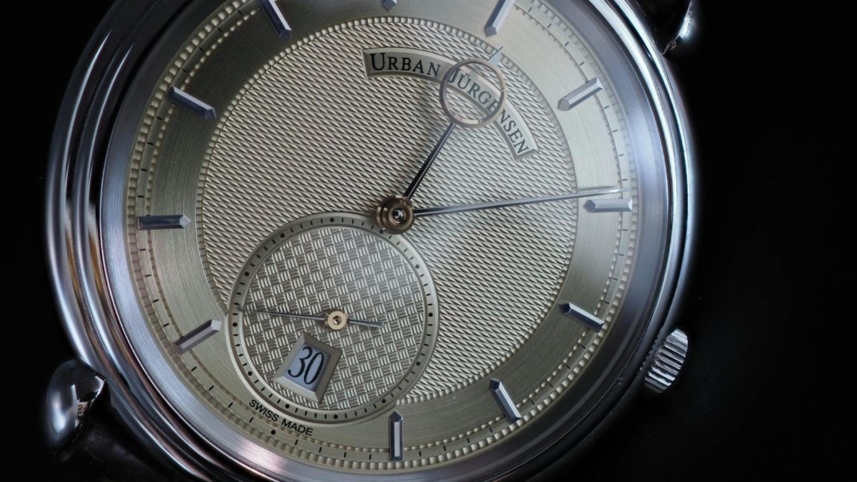 Closeup of a luxury Swiss made watch with intricate design. Ideal for elegant fashion and horology enthusiasts.