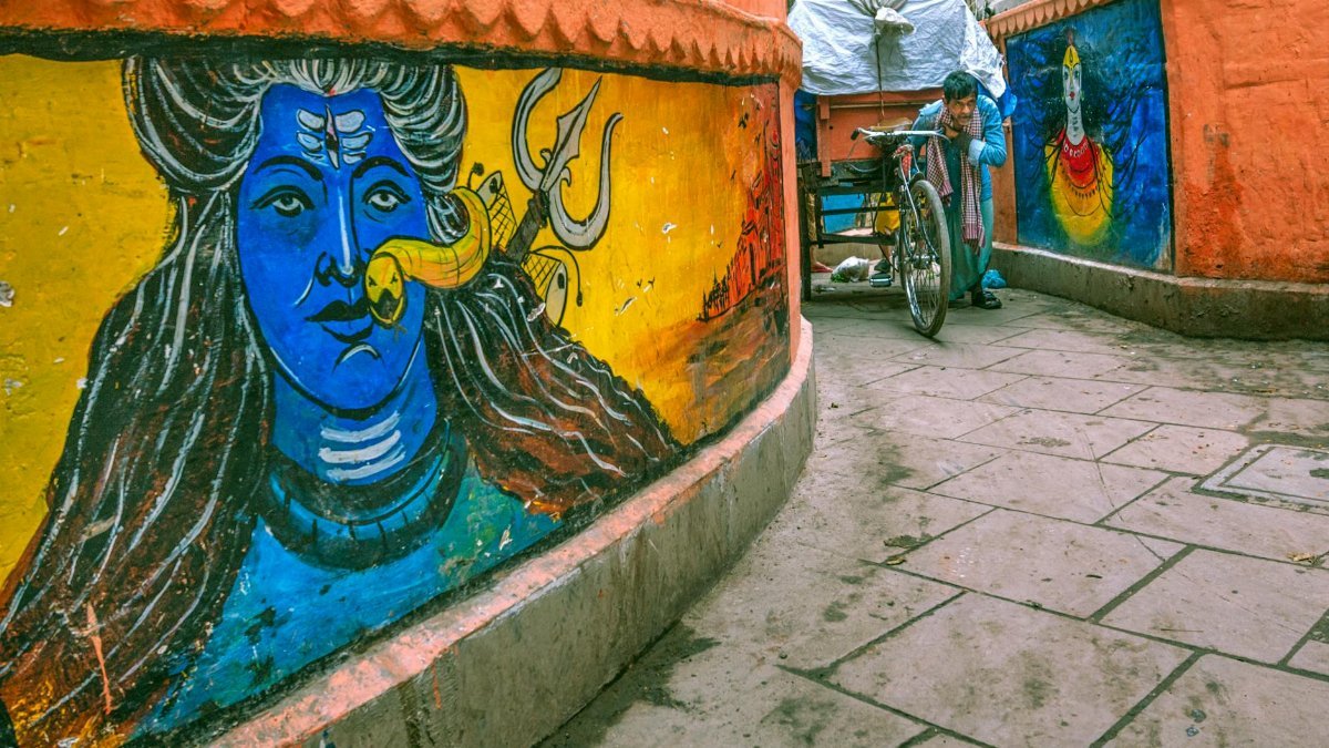 Colorful street murals in Varanasi, capturing the vibrant local culture.