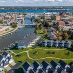 Stunning aerial view of Port Huron, Michigan featuring residential areas, waterways, and cityscape in summer.