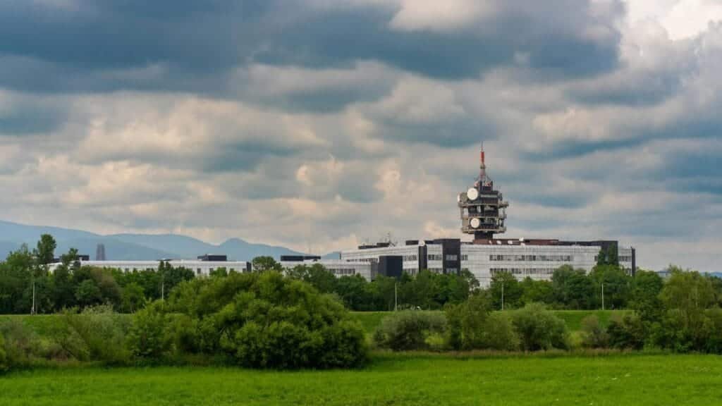Scenic view of Zagreb's public media headquarters under a cloudy sky.
