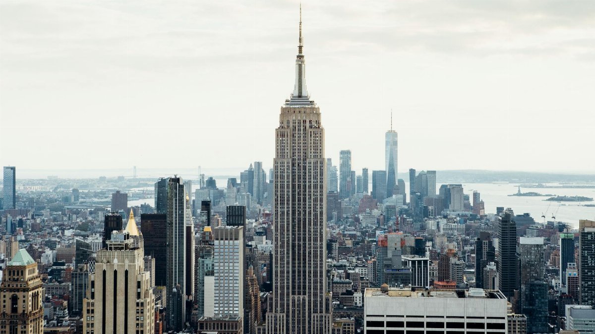 A stunning view of New York City's skyline featuring the Empire State Building during the day.