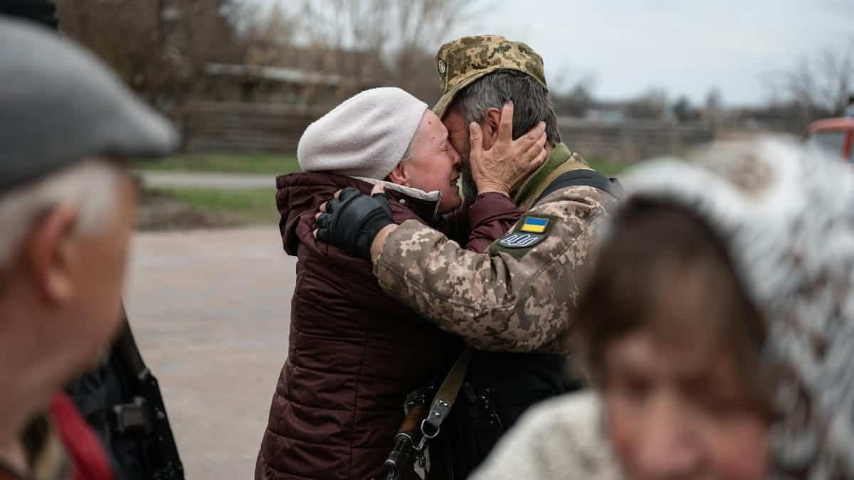 Heartfelt embrace in Makariv, Ukraine, capturing the emotional reunion.