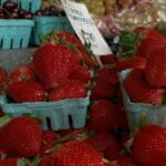 Vibrant display of fresh strawberries at a Seattle market, capturing the essence of fresh produce.