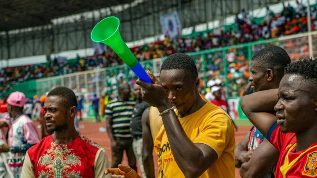 Vibrant stadium scene with diverse fans enjoying a lively sports event.