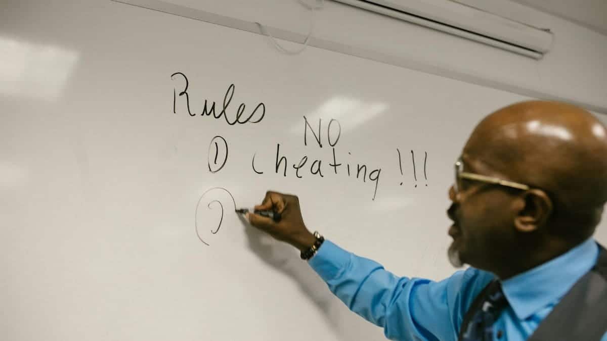 Instructor highlighting classroom rules, emphasizing no cheating policy.