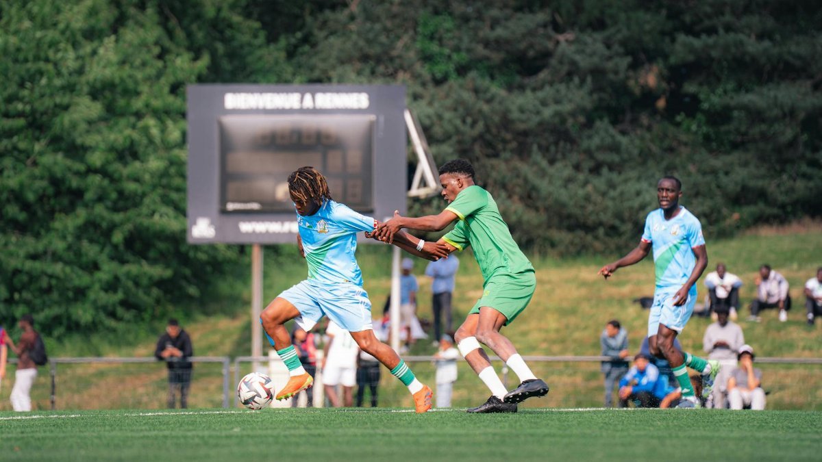 Players compete in a thrilling soccer match at Rennes, showcasing sportsmanship.