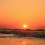 A stunning sunrise over the Atlantic Ocean at Hilton Head Island, showcasing vibrant golden hues.