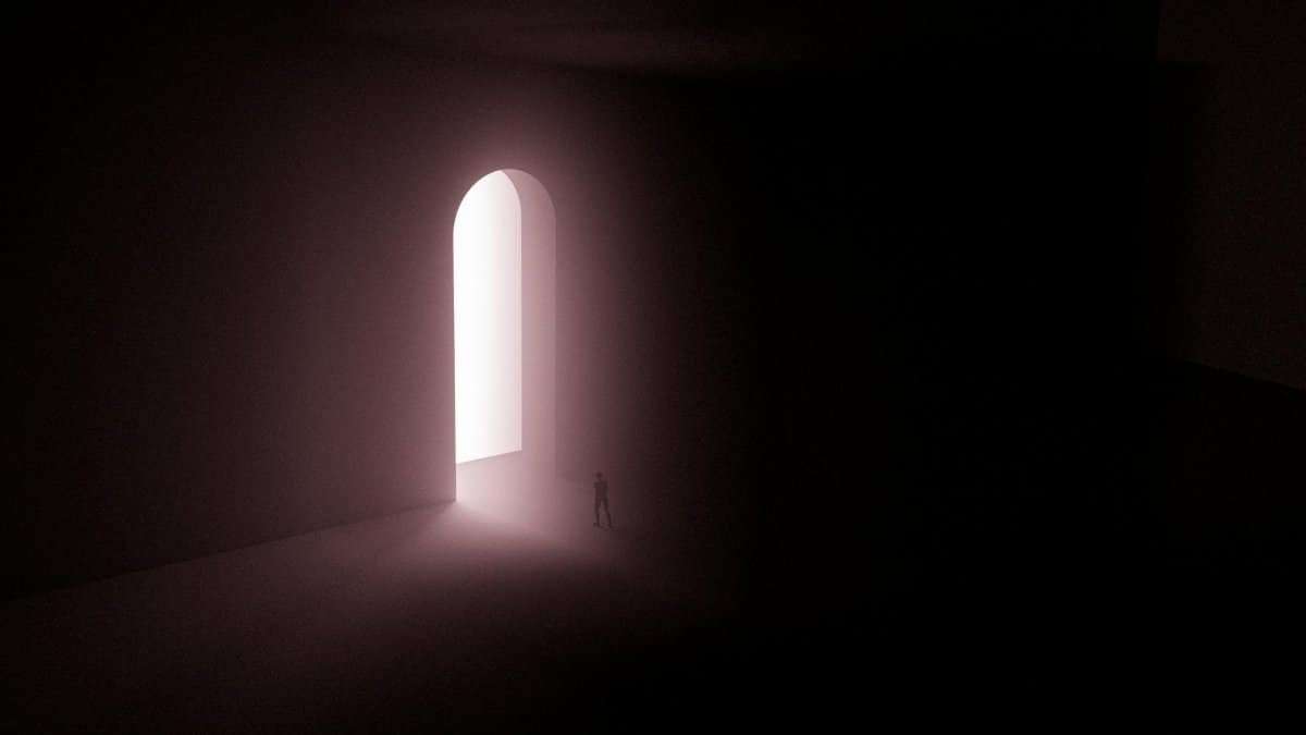 A surreal scene with a lone silhouette in front of an illuminated arched gateway.
