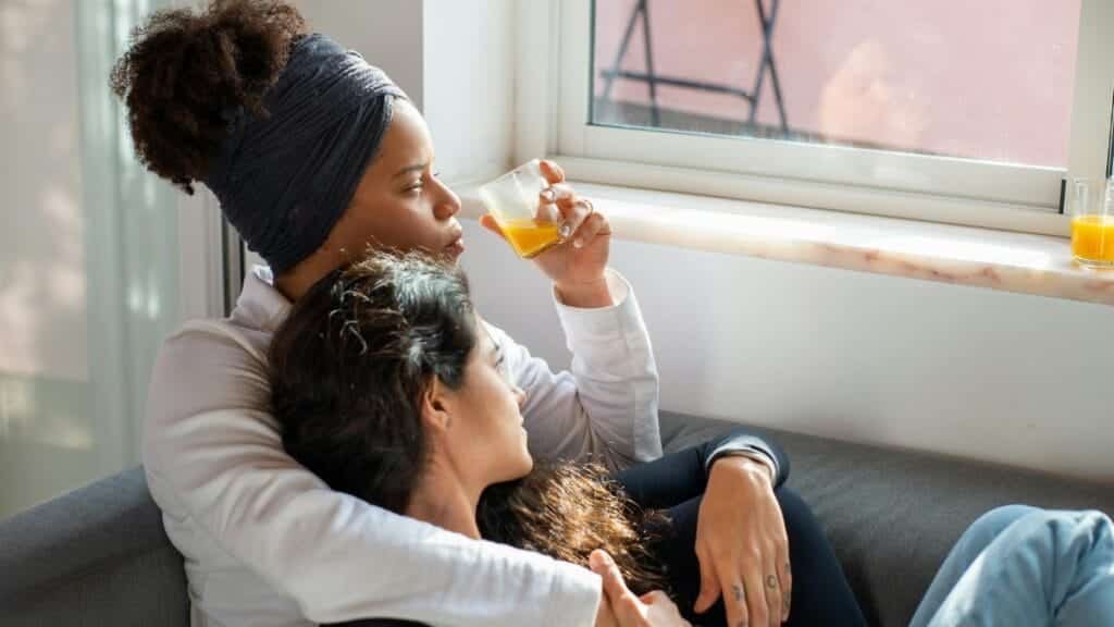 A cozy moment at home with a couple enjoying their morning by the window.