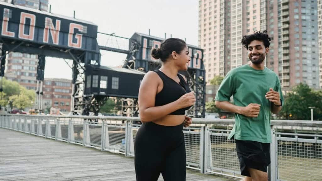 Two people jogging outdoors in Long Island City, enjoying a healthy lifestyle and sports activity.