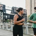 Two people jogging outdoors in Long Island City, enjoying a healthy lifestyle and sports activity.