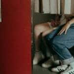 A romantic couple captured in a vintage photobooth, highlighting a nostalgic and intimate moment together.