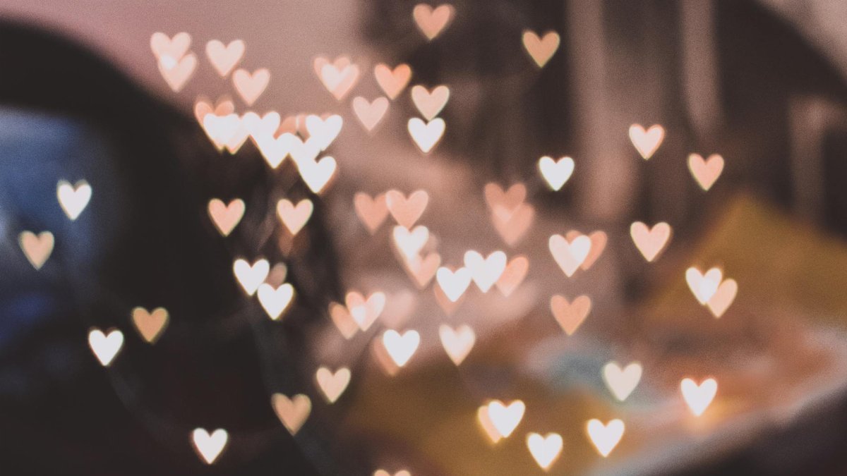 Abstract heart-shaped bokeh lights creating a romantic atmosphere.