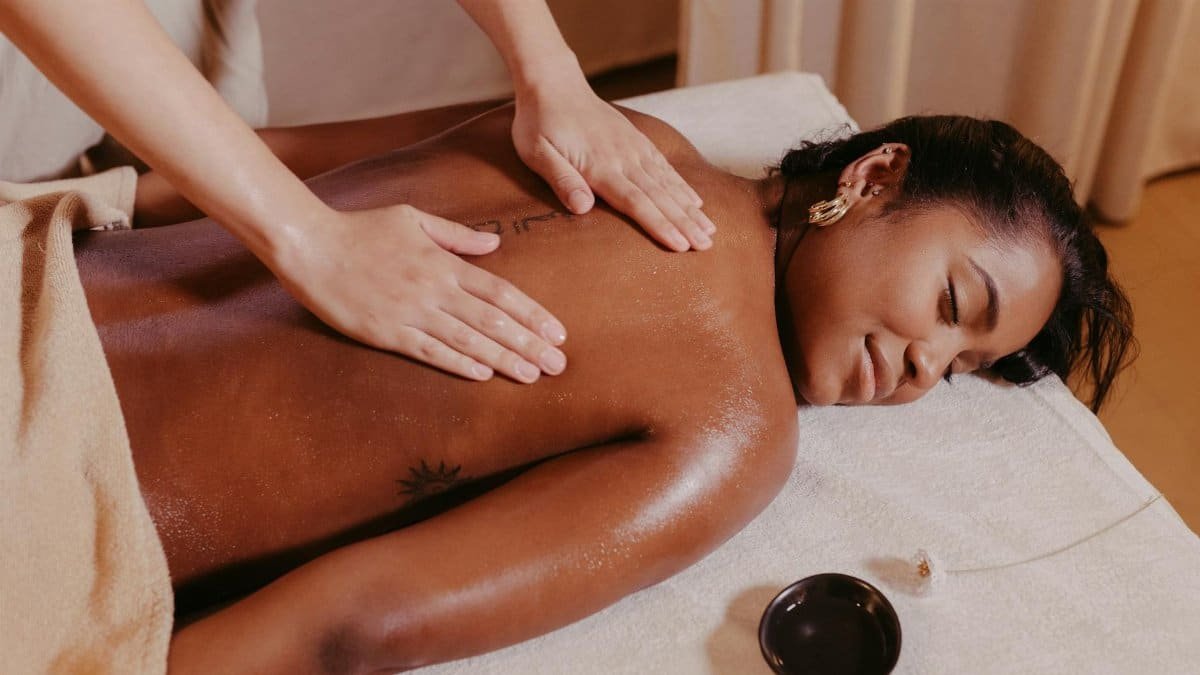 Woman enjoying a relaxing massage therapy session at the spa. Ideal for wellness or relaxation themes.