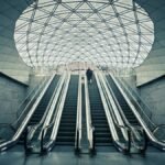 A modern underground station with escalators in Malmö, Sweden, showcasing Nordic architecture.