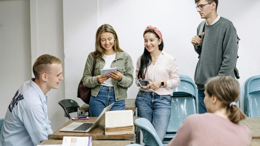A diverse group of college students engaging in a lively study session indoors.