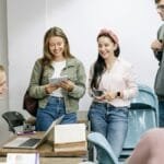A diverse group of college students engaging in a lively study session indoors.