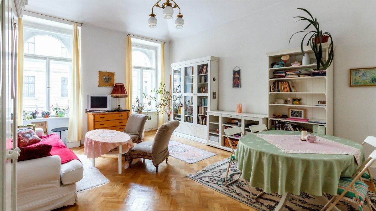 Bright and airy living room with classic vintage decor, perfect for Google Meet or Zoom backgrounds.